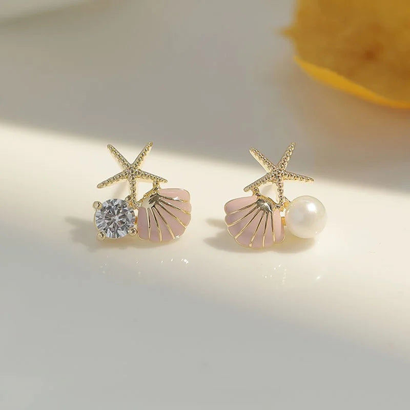 アシンメトリーなシェルピアス ピンク