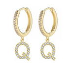 Boucles d'oreilles créoles avec initiale femme q
