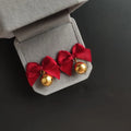 クリスマスの鈴付きリボンピアス