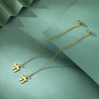 Boucles d'oreilles pendantes avec le symbole de vie juive Chai or