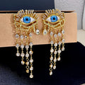 Boucles d'Oreilles Pendantes Oeil Bleu et Strass