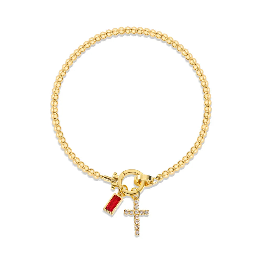 Bracelet avec croix et pierre de naissance