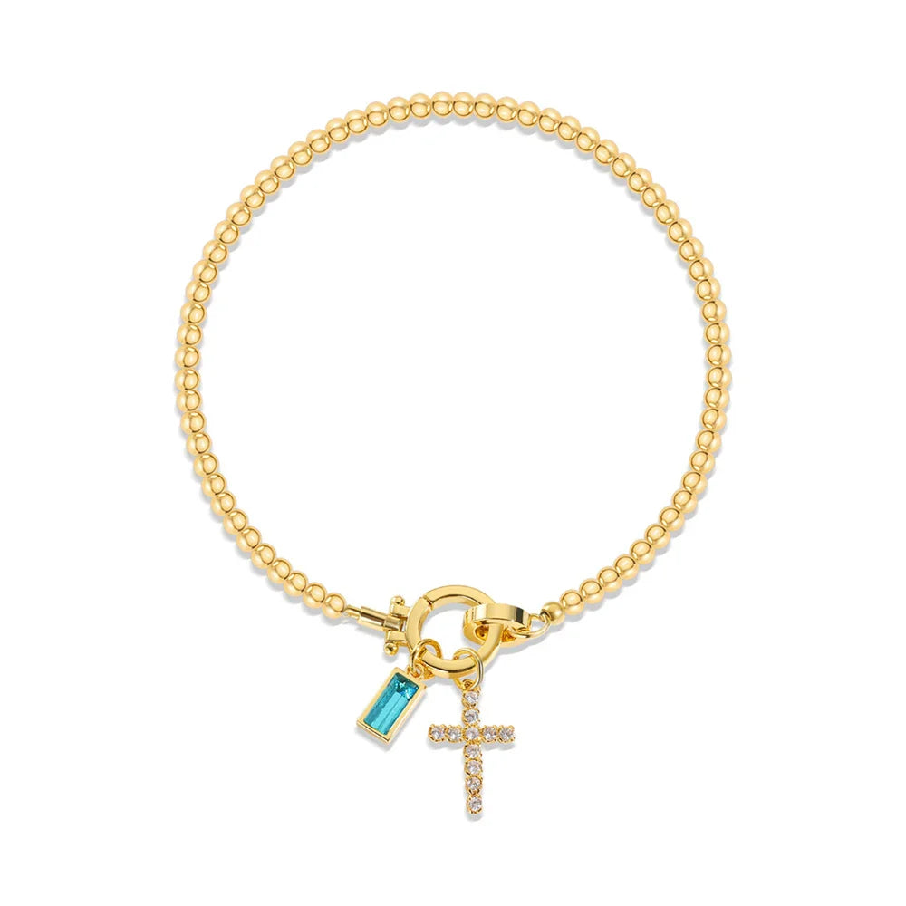 Bracelet avec croix et pierre de naissance