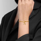 Bracelet avec croix et pierre de naissance