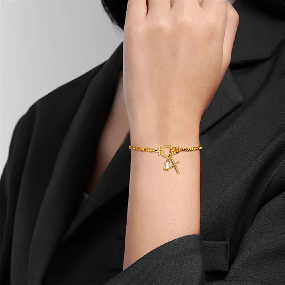 Bracelet avec croix et pierre de naissance