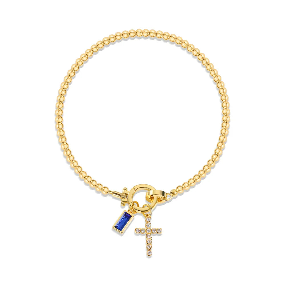 Bracelet avec croix et pierre de naissance