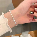 女性用シルバーの蝶結びブレスレット