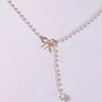 Collier de Perles avec Pendentif Noeud blanc