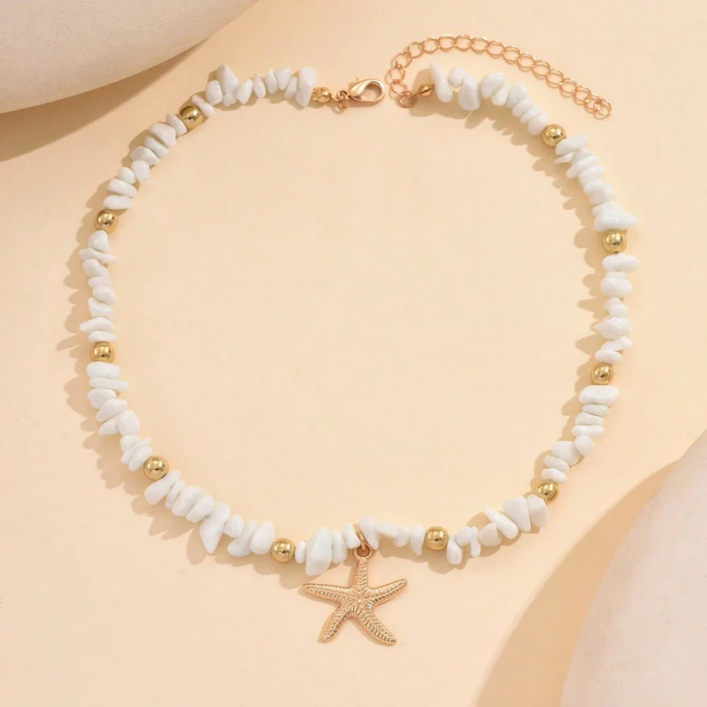Collier ras du cou coquillage et étoile de mer blanc larges perles