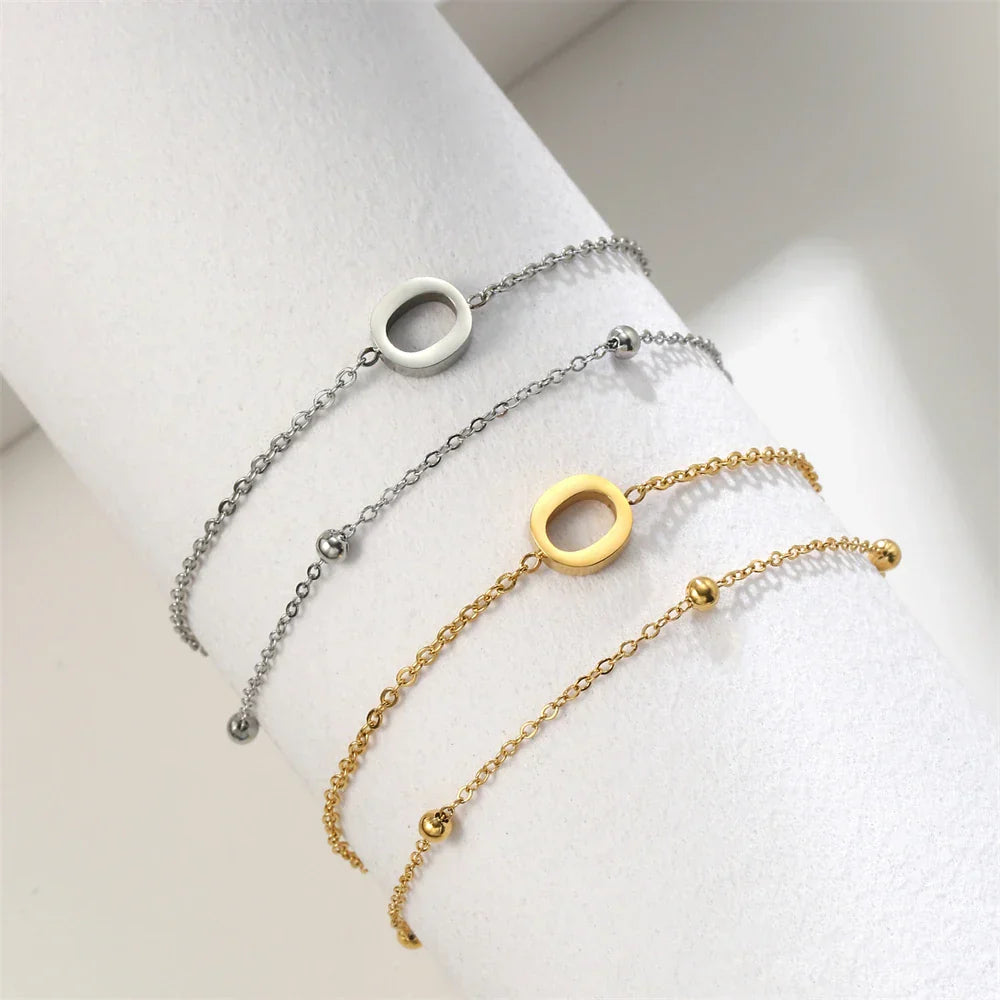 ゴールドとシルバーのダブルイニシャルブレスレット o