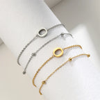 ゴールドとシルバーのダブルイニシャルブレスレット o