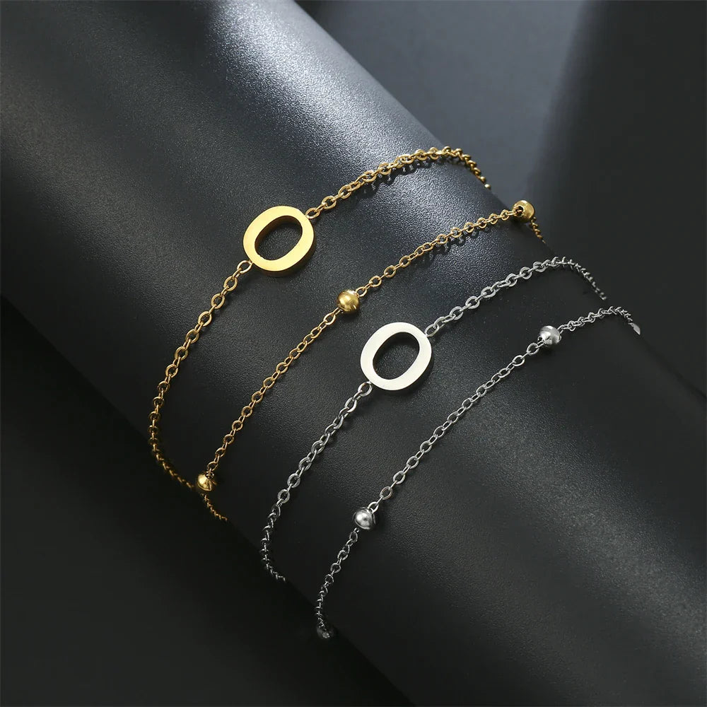 ゴールドとシルバーのダブルイニシャルブレスレット o